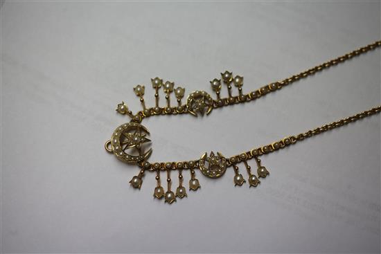 An Edwardian gold and split pearl set fringe necklace, 15in.